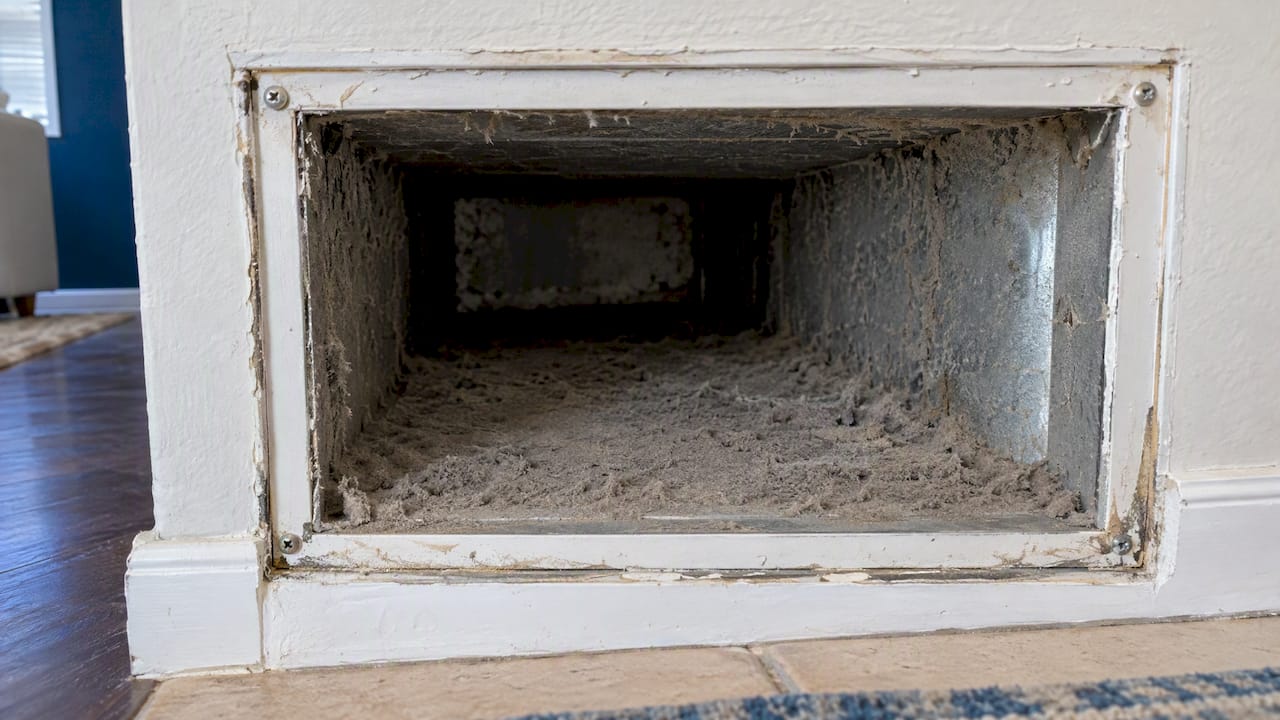 Dust buildup visible inside residential return duct