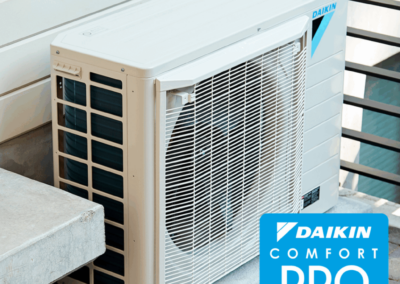 Freshly installed AC condenser with a new disconnect box and level concrete pad.