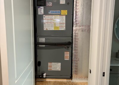 New high-efficiency AC condenser installed next to a Florida patio by AC Heroes.