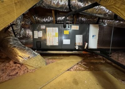 AC Heroes technician checking refrigerant lines on a residential air conditioner in Bradenton.